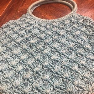 Blue net bag with a round handle